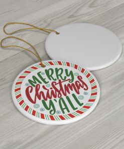 Round ornament with 'Merry Christmas Y'all' in festive green and red script, surrounded by candy cane stripes and snowflakes