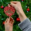 Elegant red, white, and green Merry Christmas Ornament heart shape