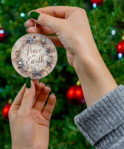 Christmas ornament is designed in a light gray and beige palette with the words Merry Christmas on it.