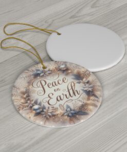 Christmas ornament is designed in a light gray and beige palette with the words Merry Christmas on it.