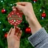 Elegant red, white, and green round Merry Christmas Ornament