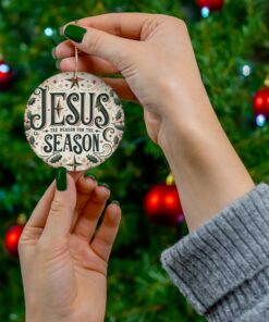 Christmas Ornament with vintage design, 'Jesus: The Reason for the Season,' holly leaves, berries, and earthy background