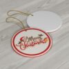 This Christmas ornament showcases the text "Merry Christmas" in an elegant script, accented with holly leaves and berries