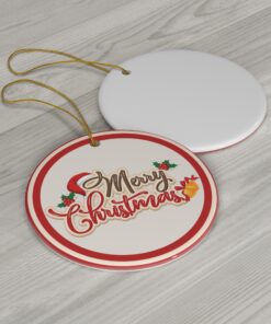 This Christmas ornament showcases the text "Merry Christmas" in an elegant script, accented with holly leaves and berries