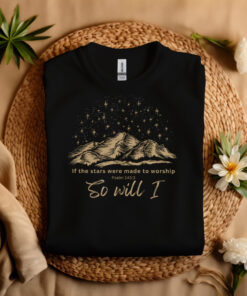 Black folded t-shirt with picture of night sky and the quote, "Stars Were Made to Worship "