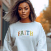 White Gildan 1800 Sweatshirt the the word Faith across the chest