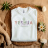 White-flat-lay-T-Shirt-with-Yeshua-Jesua-HaMashiach-written-in-multiple-colors.