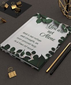 An Inspirational Journal with dark green border and the words, "You are not alone" and "God is our refuge and strength, an ever-present help in a time of need"