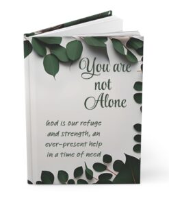 An Inspirational Journal with dark green border and the words, "You are not alone" and "God is our refuge and strength, an ever-present help in a time of need"