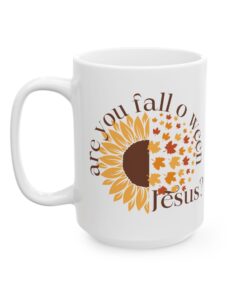 White ceramic coffee mug with the phrase “Are You Fall-o-Ween Jesus?” in festive fall colors. Features a playful Christian theme for fall.