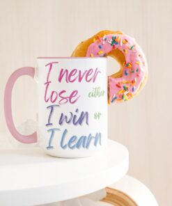 15 oz white ceramic mug features the inspiring quote by Mandela: "I never lose. I either win or I learn."