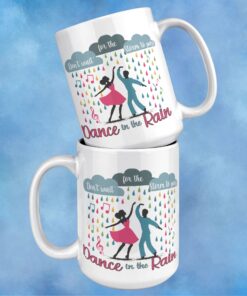 Colorful coffee mug featuring dancers in the rain with the inspirational phrase 