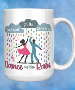 Colorful coffee mug featuring dancers in the rain with the inspirational phrase 