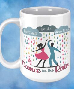 Colorful coffee mug featuring dancers in the rain with the inspirational phrase 