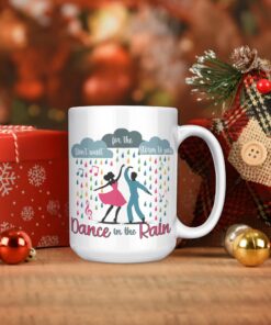 Colorful coffee mug featuring dancers in the rain with the inspirational phrase 