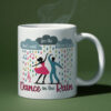 Colorful coffee mug featuring dancers in the rain with the inspirational phrase "Don’t wait for the storm to pass, dance in the rain."