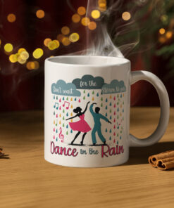 Colorful coffee mug featuring dancers in the rain with the inspirational phrase 