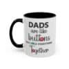 11 oz White ceramic mug with black rim and handle featuring the phrase “Dads are like buttons they hold everything together” left view