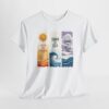 White T-shirt displaying three vertical panels: an orange sun over wavy lines with “Live in the Sunshine,” a stylized wave with “Swim the Sea,” and a sky-and-wave scene with “Drink the Wild Air.