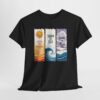 Black T-shirt displaying three vertical panels: an orange sun over wavy lines with “Live in the Sunshine,” a stylized wave with “Swim the Sea,” and a sky-and-wave scene with “Drink the Wild Air.