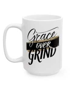Christian Coffee Mug - Grace Over Grind with bold black script and gold brushstroke, faith based inspirational gift.