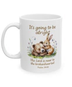 11 oz Scripture Ceramic Mug - It's Going to Be Alright Christian Comfort Mug with watercolor bear and bunny design, pastel flowers, and the scripture “The Lord is near to the brokenhearted Psalm 34:18right view