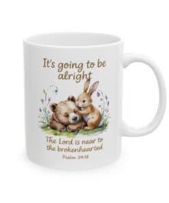 11 oz Scripture Ceramic Mug - It's Going to Be Alright Christian Comfort Mug with watercolor bear and bunny design, pastel flowers, and the scripture “The Lord is near to the brokenhearted Psalm 34:18 left view