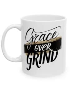 Christian Coffee Mug - Grace Over Grind with bold black script and gold brushstroke, faith based inspirational gift.