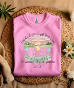 Pink Flat fold Children Are a Gift From God Floral Christian T-Shirt featuring a watercolor sunrise, handprint flowers, and faith-based quote.