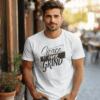 White Gildan 5000 Grace Over Grind t-shirt features bold calligraphy, gold and black brushstrokes, and an inspirational Christian faith message