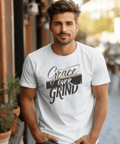 White Gildan 5000 Grace Over Grind t-shirt features bold calligraphy, gold and black brushstrokes, and an inspirational Christian faith message