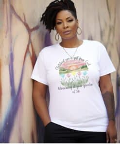 White Children Are a Gift From God Floral Christian T-Shirt featuring a watercolor sunrise, handprint flowers, and faith-based quote.