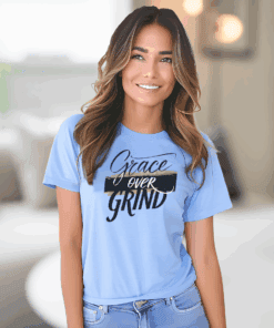 Caroline colored Gildan 5000 Grace Over Grind t-shirt features bold calligraphy, gold and black brushstrokes, and an inspirational Christian faith message