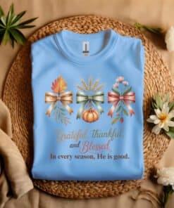 Grateful Thankful Blessed Christian T-Shirt Coralina Blue Gildian 5000 laying on a straw hat Autumn Gratitude