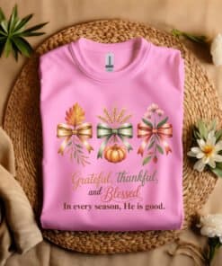 Grateful Thankful Blessed Christian T-Shirt Azalea color Gildian 5000 laying on a straw hat Autumn Gratitude Celebration