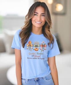 Woman wearing a Carolina Blue Gildan 5000 T-Shirt with Grateful Thankful Blessed on it.