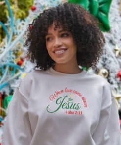 African American wearing a sweatshirt that says When love came down