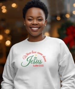 African American wearing a sweatshirt that says When love came down