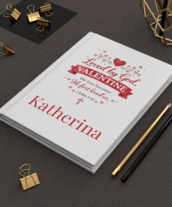 Personalized Valentine's notebook on desk.